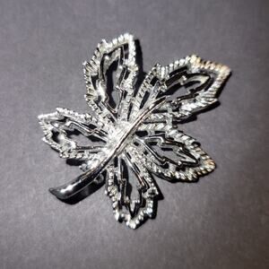 Silver tone leaf brooch